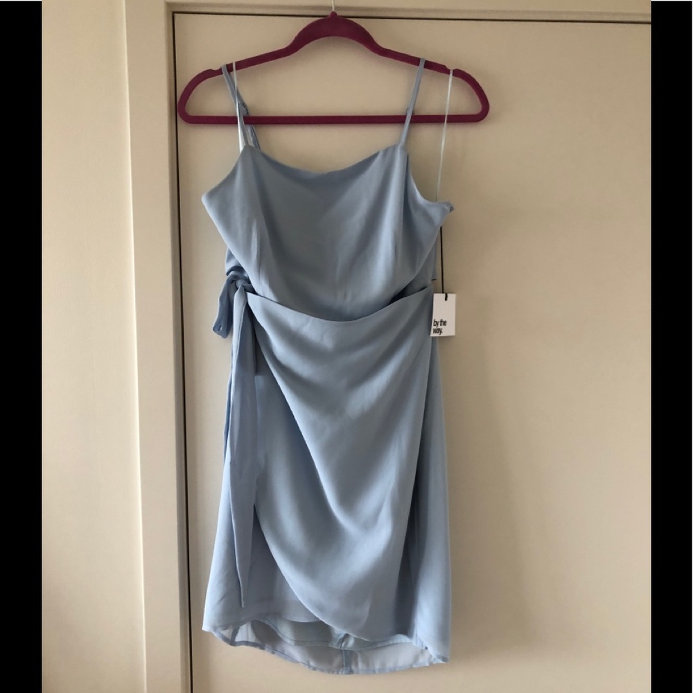 Never worn, open/tie back, side tie front dress